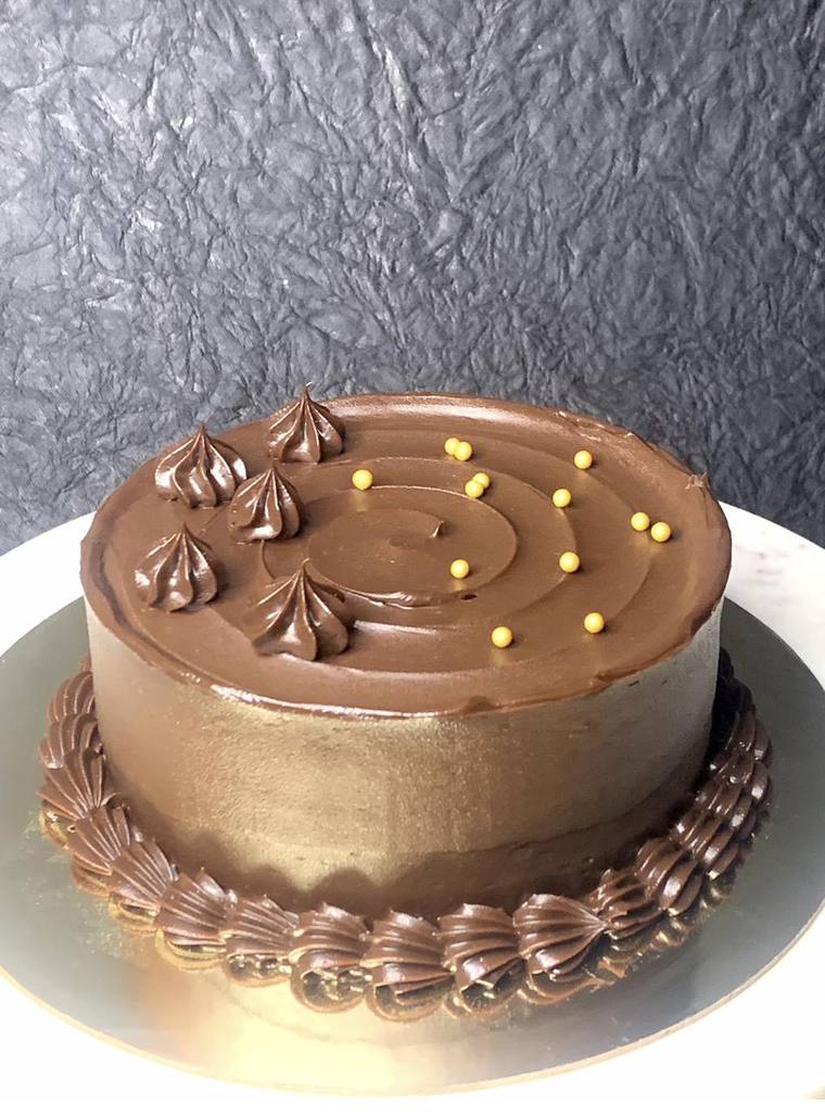 Chocolate truffle celebration cake with gold finish