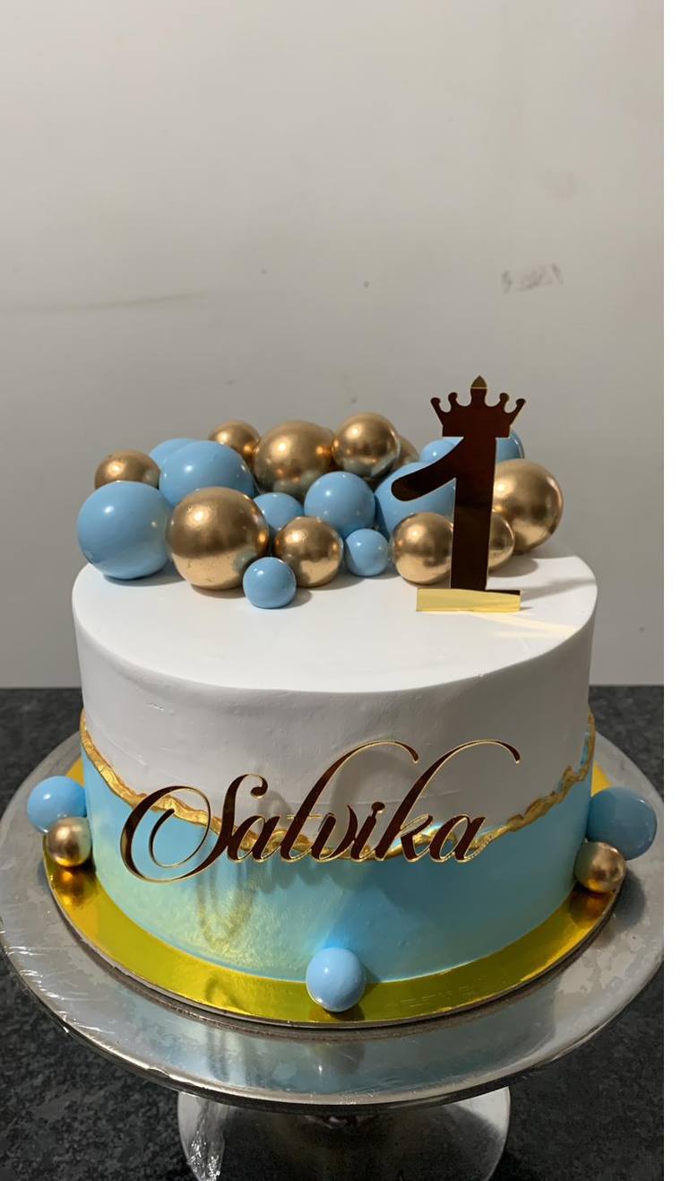 Blue and gold first birthday cake