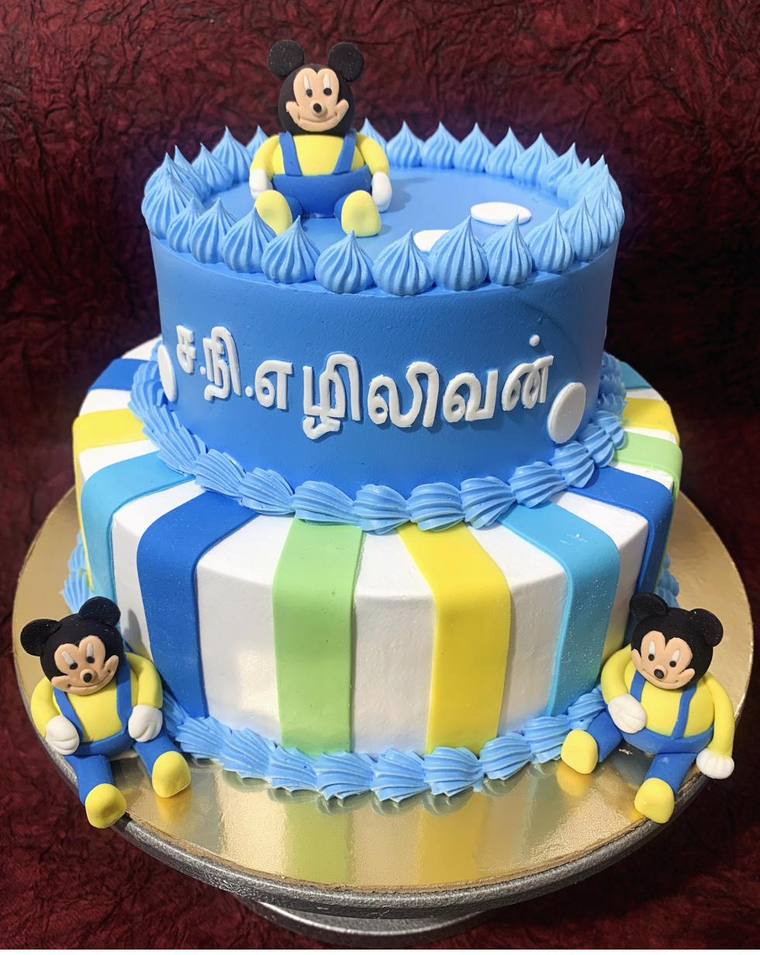 Two-tier themed celebration cake with Tamil name