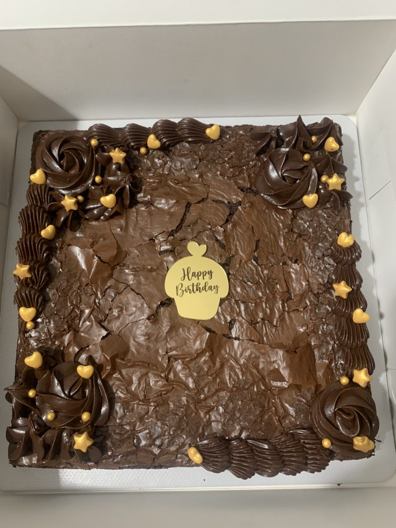 Chocolate brownie celebration slab finished with gold accents